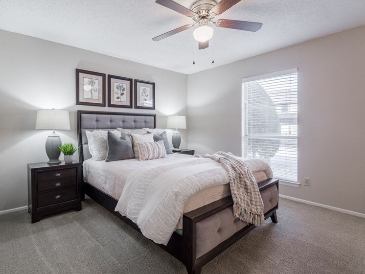Spacious bedroom with ceiling fan  at Country Square, Carrollton, Texas